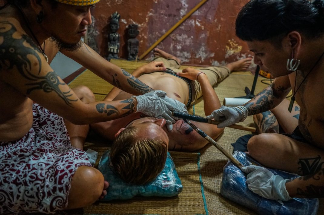 Getting a Hand Tapped Dayak Tattoo in Borneo - Uncharted Backpacker